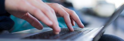 Fingers tapping on a keyboard