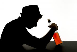 Alcoholic man with a bottle