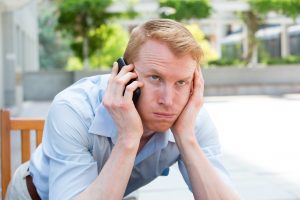 frustrated man on the phone