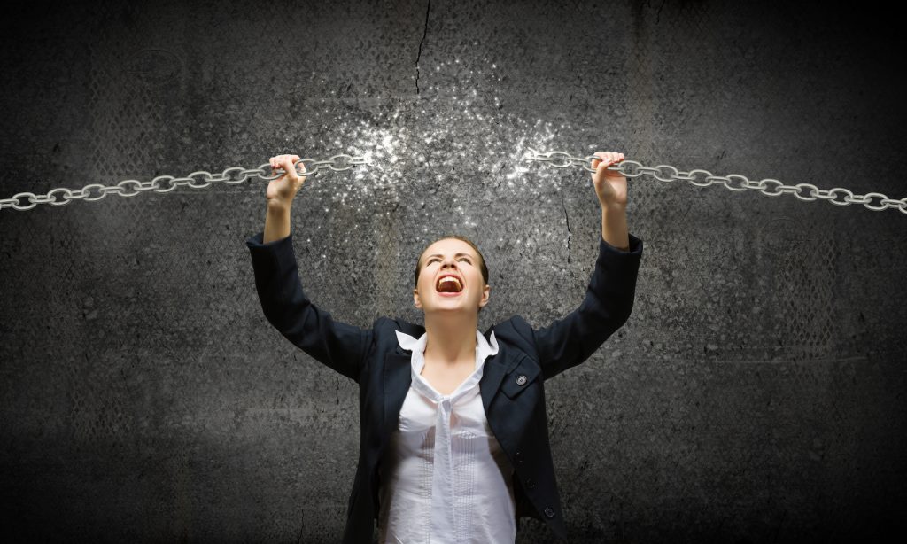 business woman braking a chain