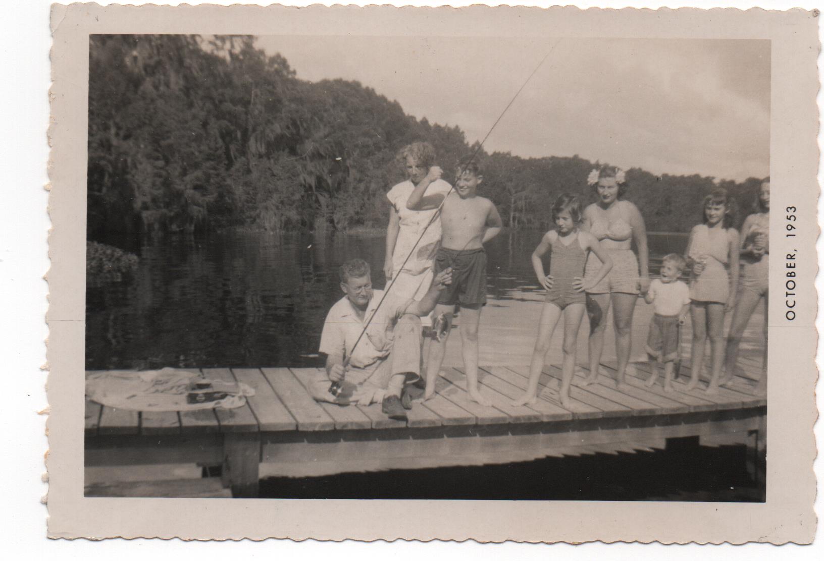 Cousins lined up on a dock for a snapshot