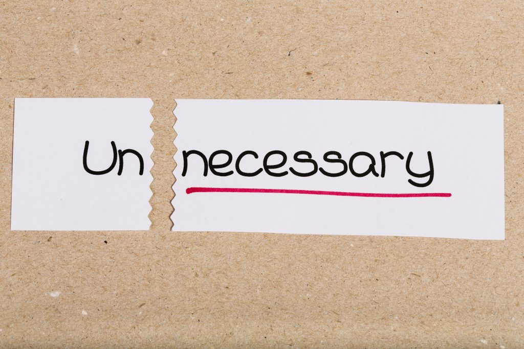Sign with word unnecessary turned into necessary