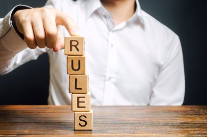 Rules spelled out with an unstable stack of blocks