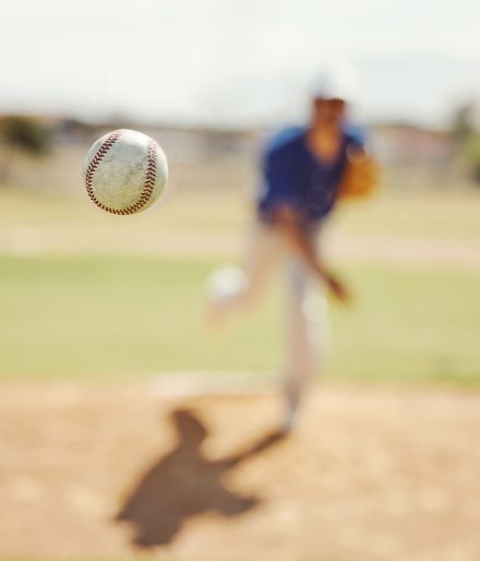 A baseball player throwing a ball